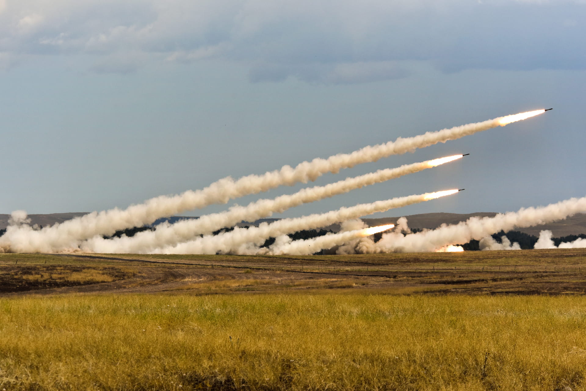 A series of missiles being launched from the ground
