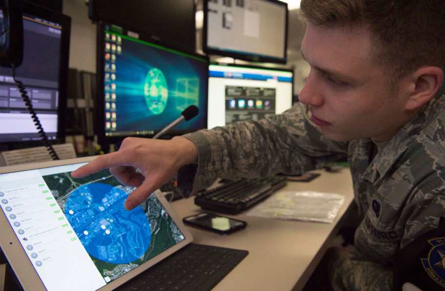 young soldier controlling a C2 on a tablet